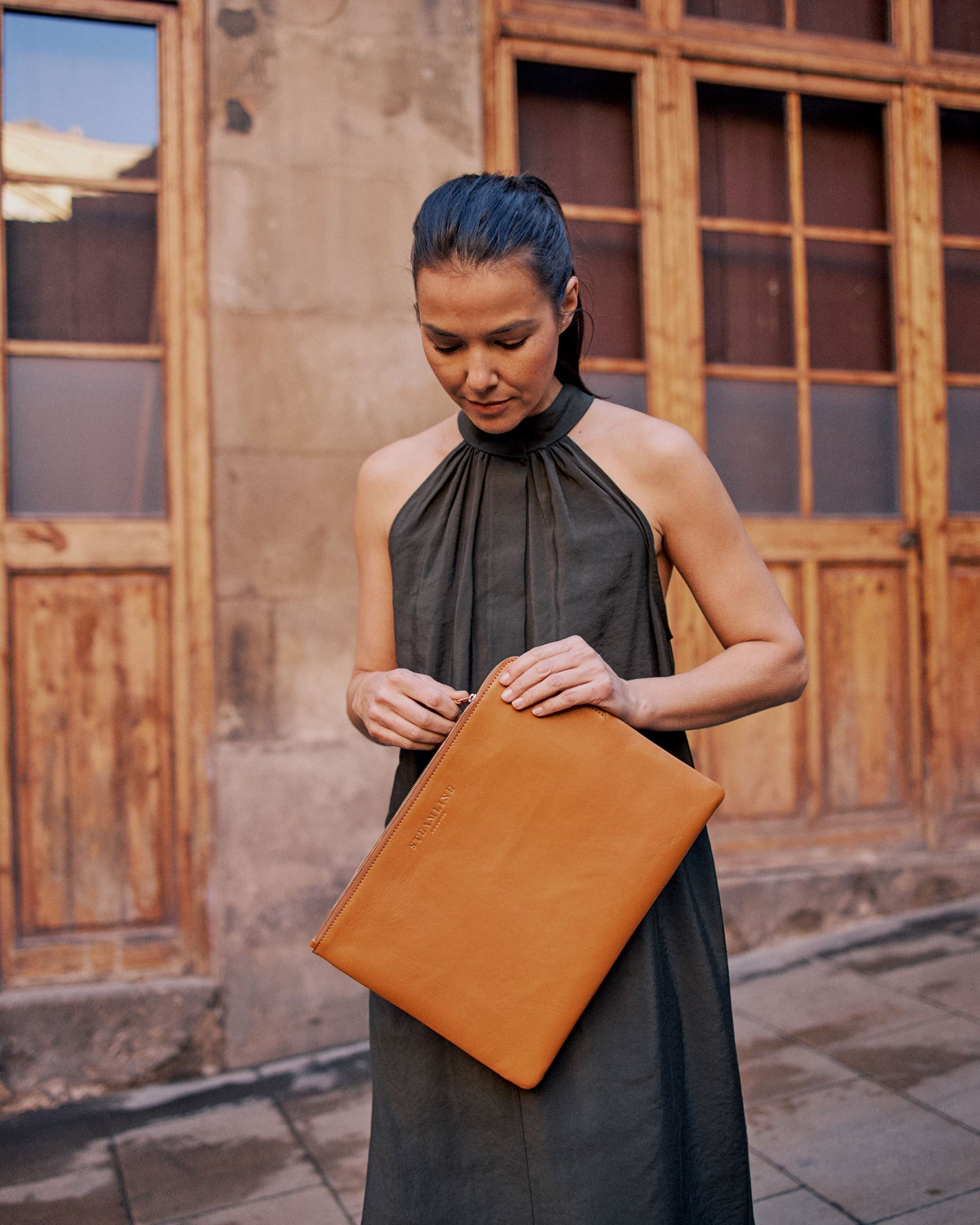 model holding nut leather laptop case