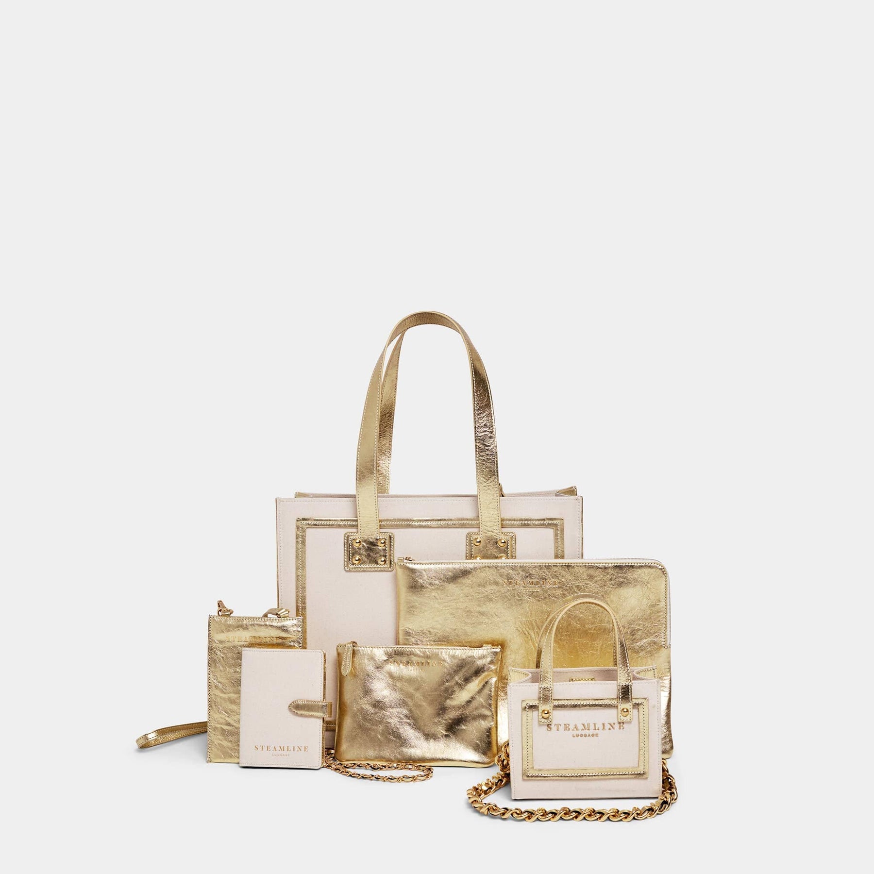 Designer travel set of The Navigator handbag in sustainable canvas and gold leather with gold trims