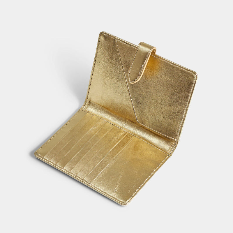 Open product view of the Navigator leather passport holder in gold with gold trim