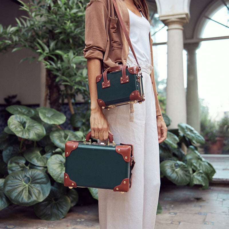 Lifestyle image of model with The Diplomat leather handbags in hunter green