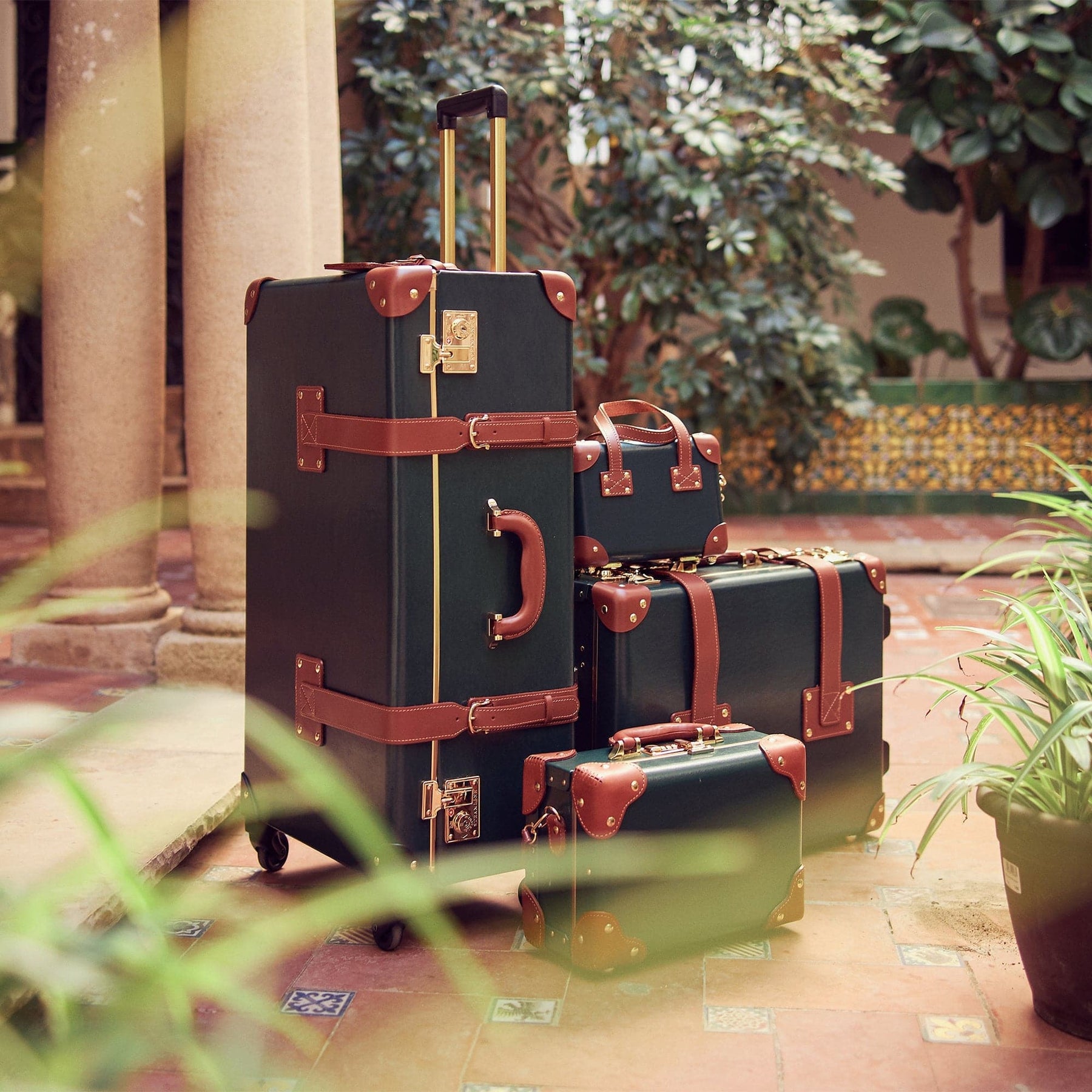 Lifetysle image of The Diplomat leather luggage set  in hunter green