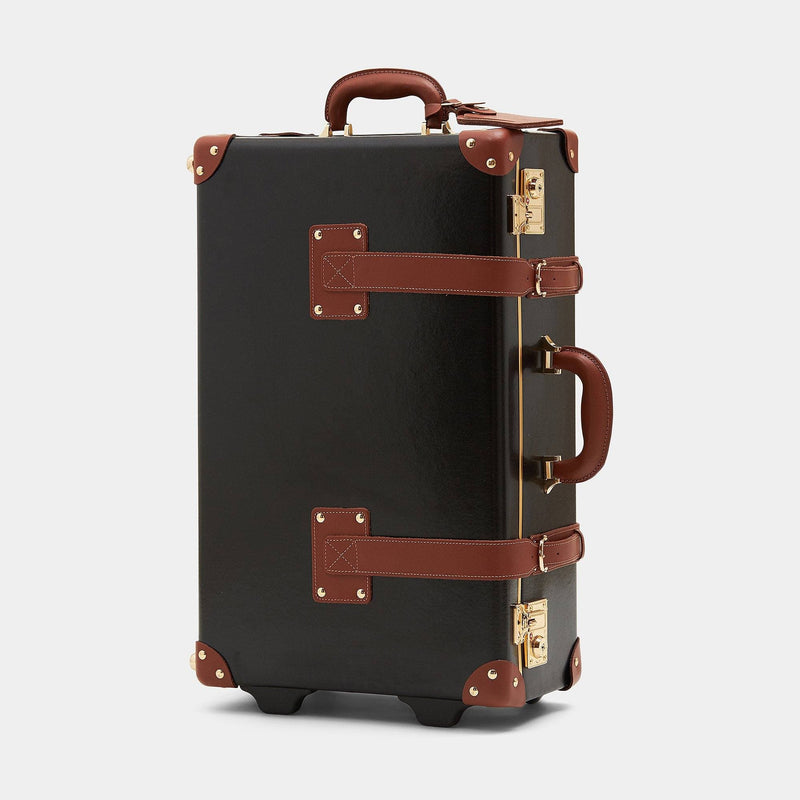 Angled product view of the stowaway Diplomat leather suitcase in black