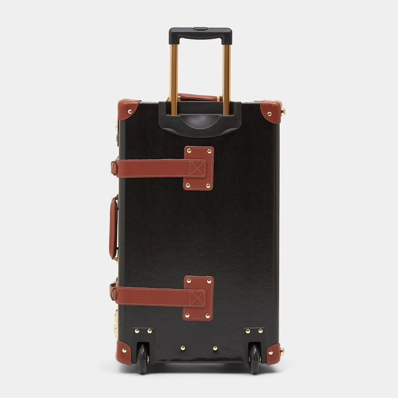 Back product view of the stowaway Diplomat leather suitcase in black with raised handle