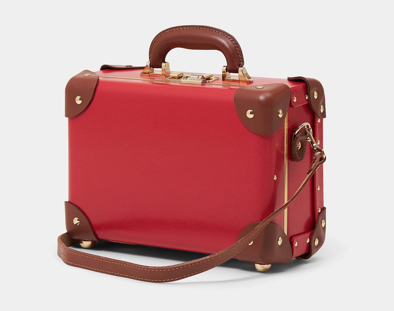 Angled product view of the vanity Diplomat leather suitcase in red with shoulder attachment strap