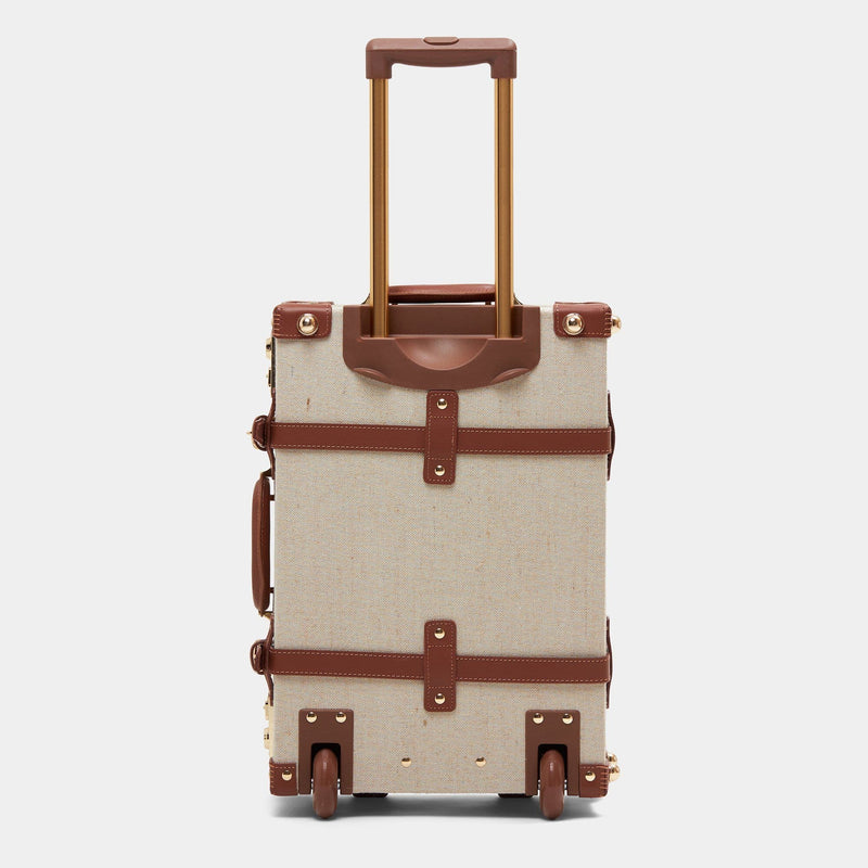 Back product view of the carry-on Editor linen suitcase with brown trims and raised handle