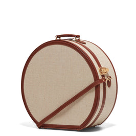 Angled product view of the deluxe hatbox Editor linen suitcase with brown trims and shoulder attachment strap