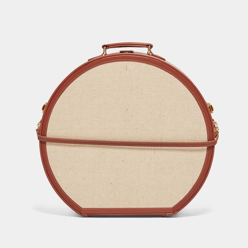 Back product view of the deluxe hatbox Editor linen suitcase with brown trims and detachable suitcase strap