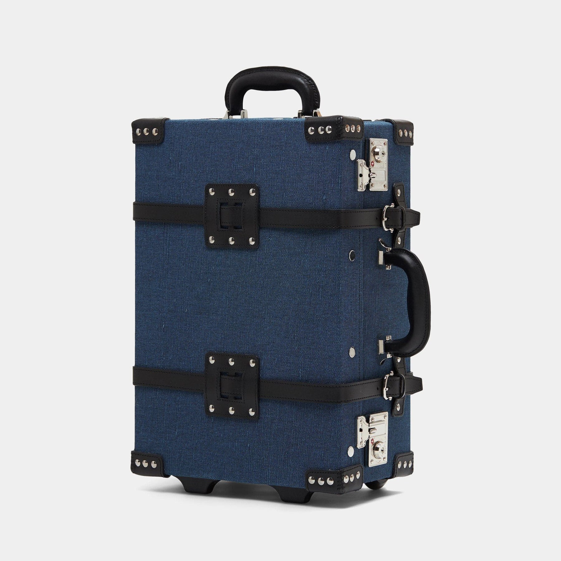 Angled product view of the carry-on Editor linen suitcase with navy body and black trims