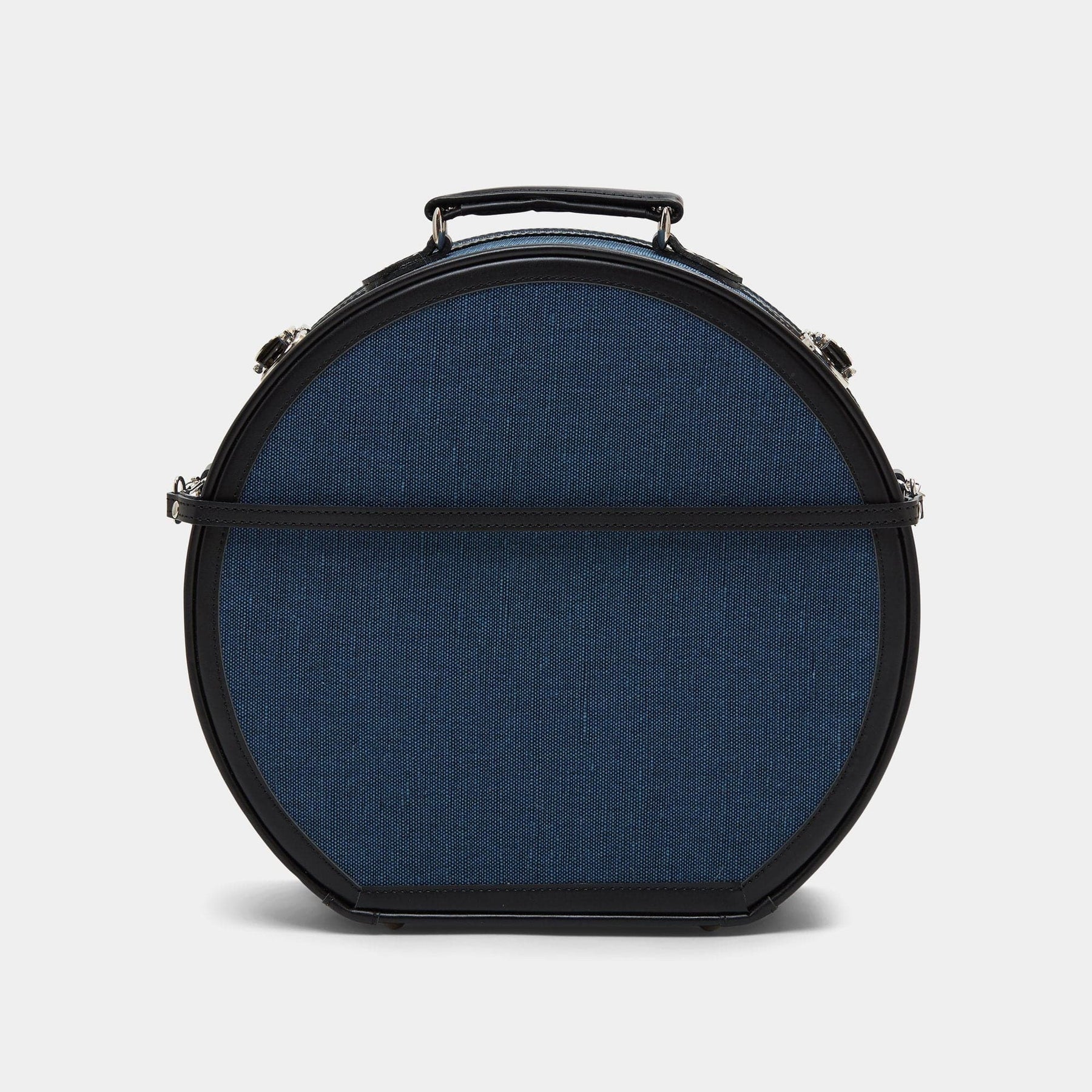 Back product view of the large hatbox Editor linen suitcase with navy body, black trims and detachable suitcase strap