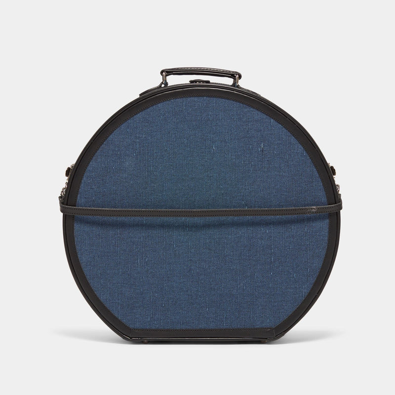 Back product view of the deluxe hatbox Editor linen suitcase with navy body, black trims and detachable suitcase strap