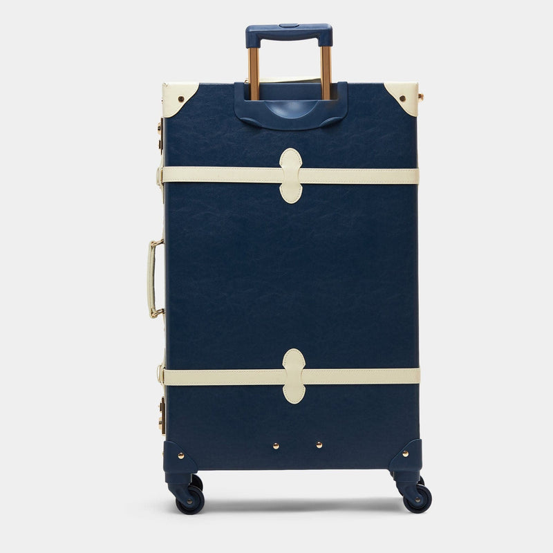 Back product view of the check-in spinner Entrepreneur vegan leather suitcase in navy with raised handle