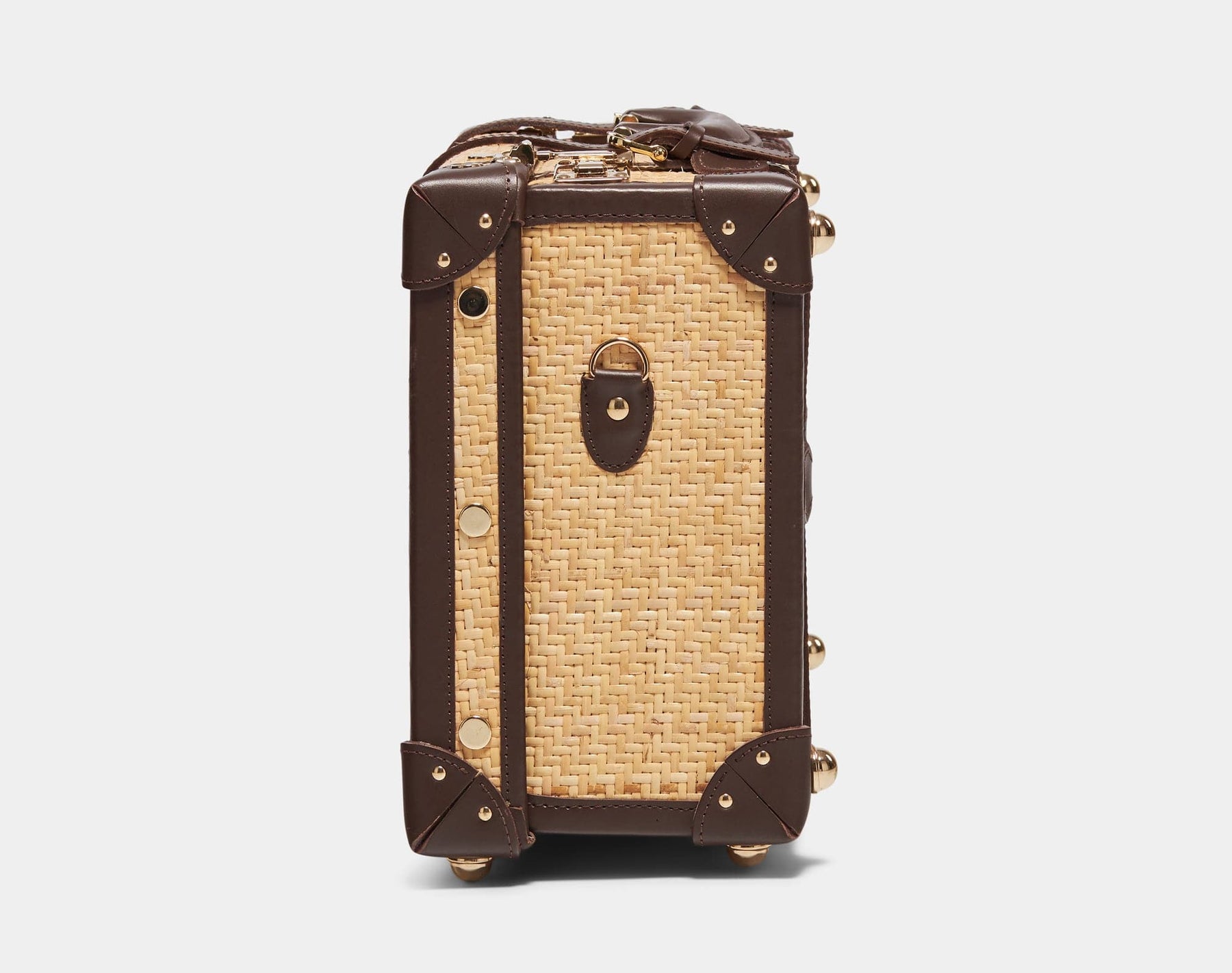 Side product view of the overnighter Explorer rattan suitcase in  natural wicker body and brown trims