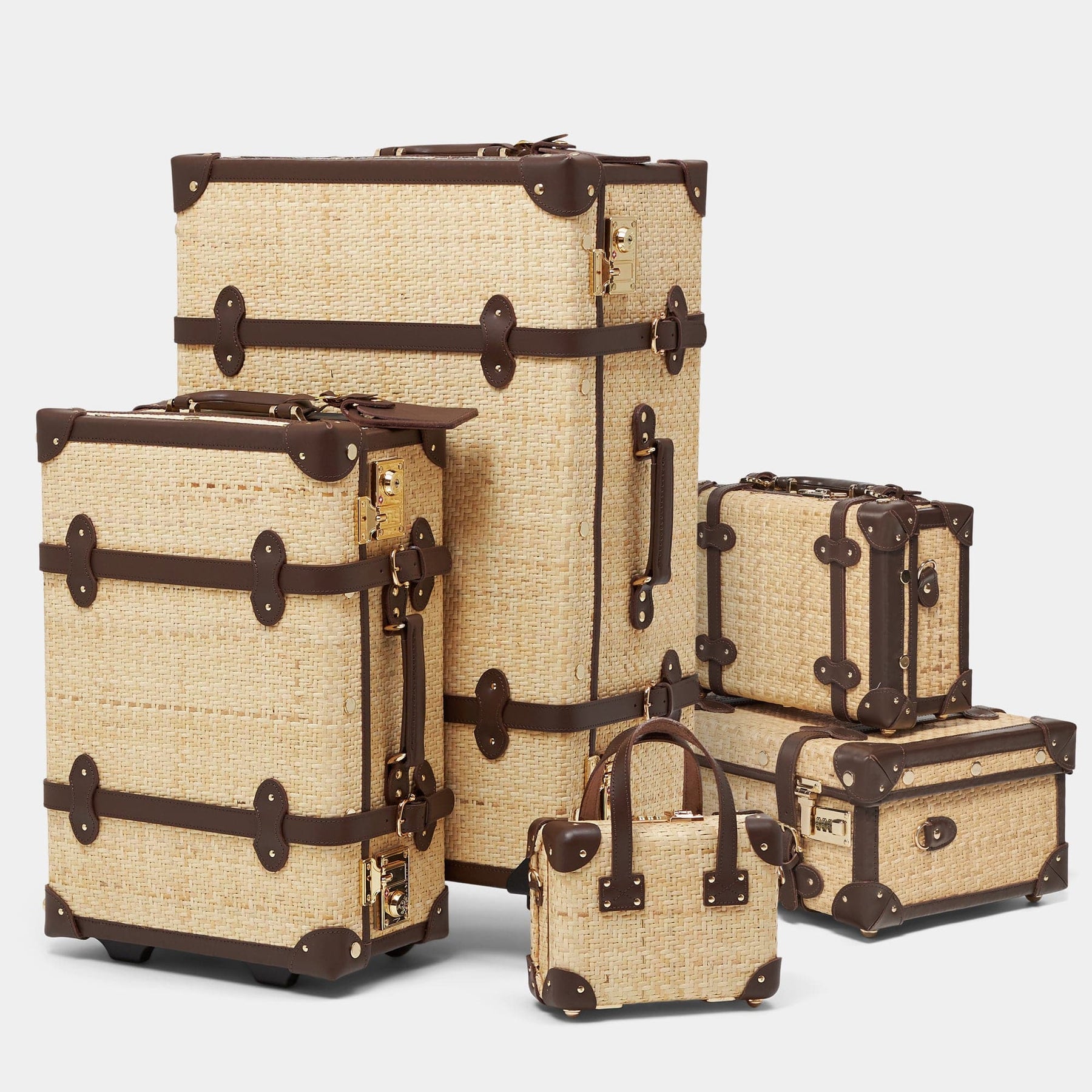 Vintage luggage set of the Explorer rattan suitcase in natural wicker body and brown trims