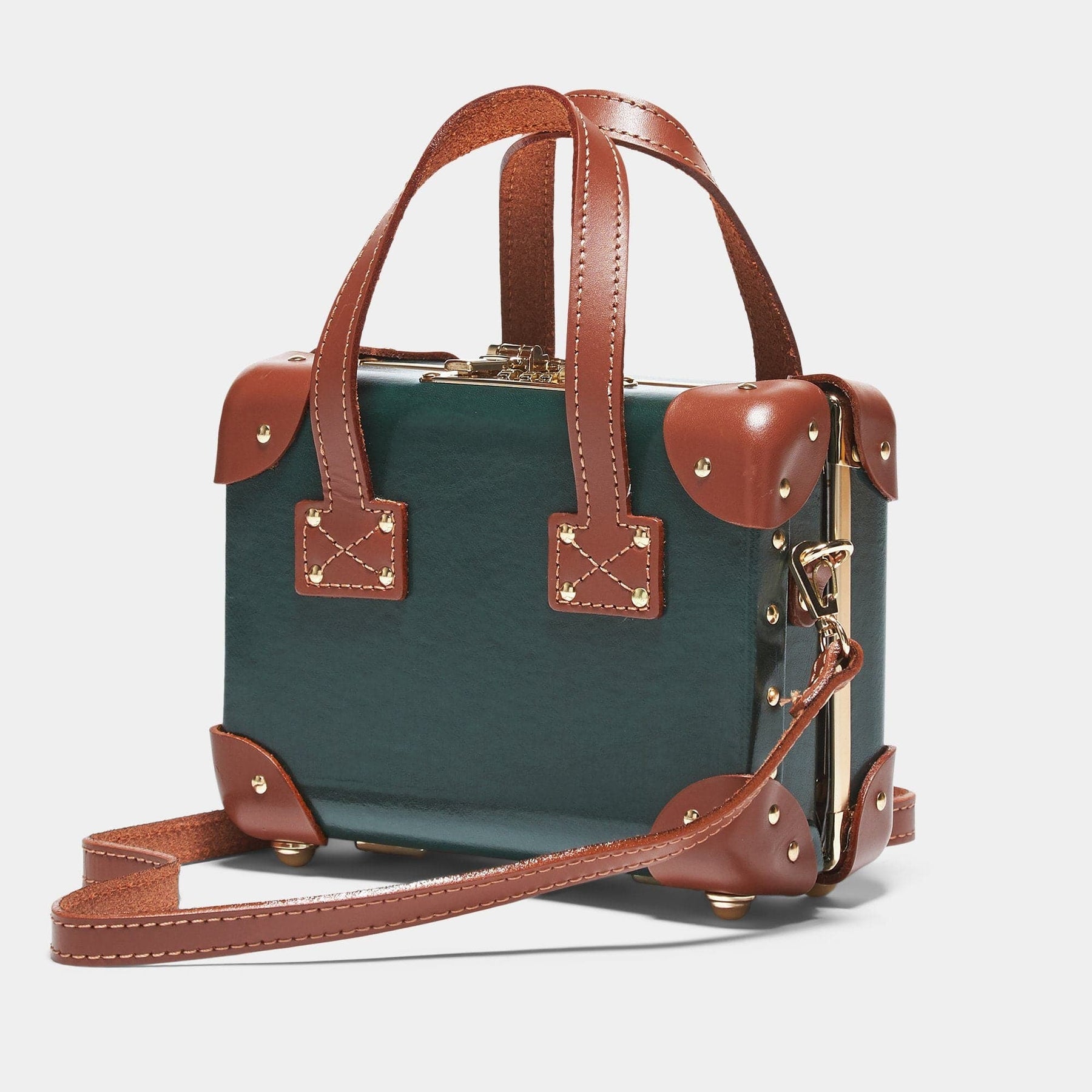 Angled product view of the mini Diplomat leather suitcase in hunter green with shoulder attachment strap