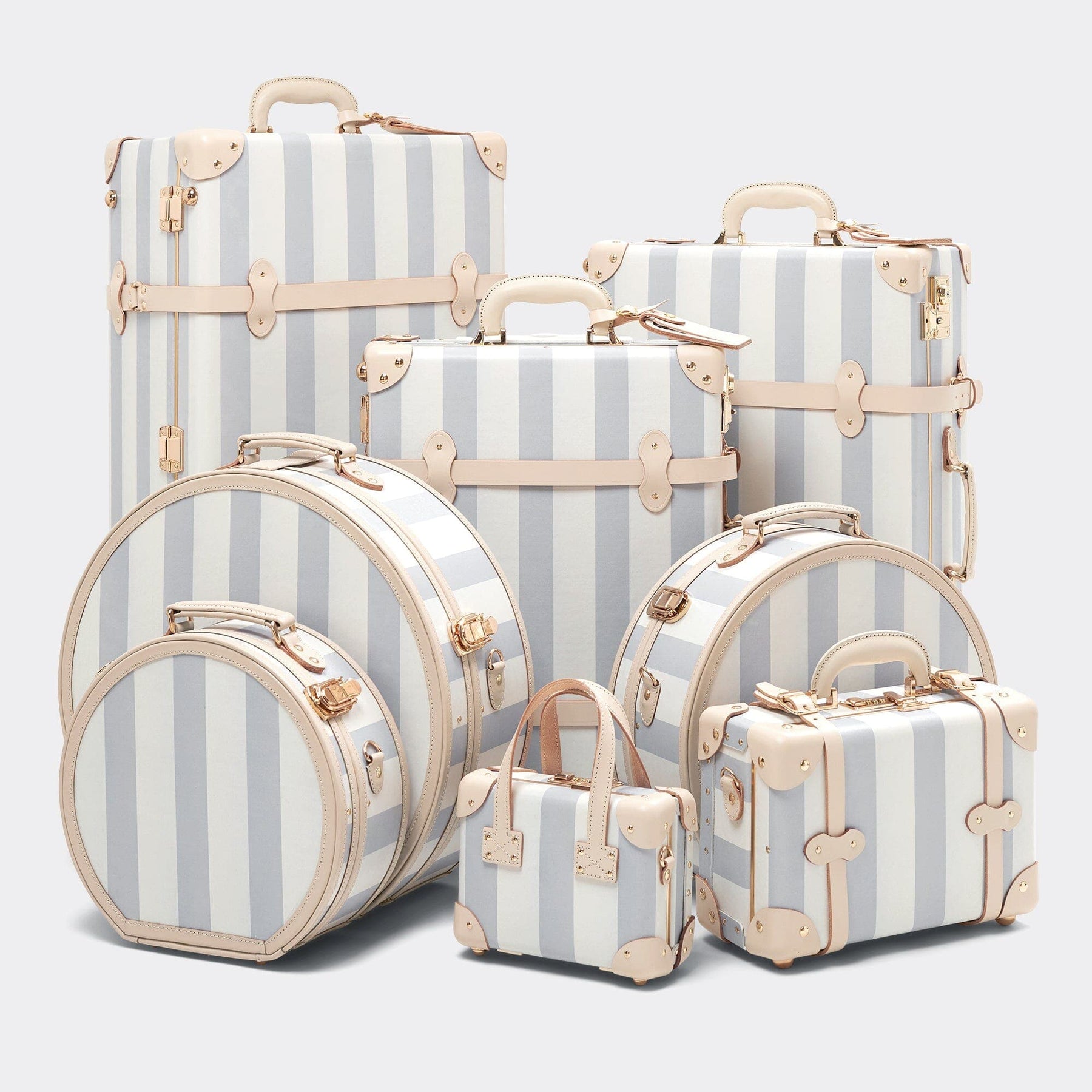 Designer luggage set of The Illustrator fibreboard suitcase in blue stripe