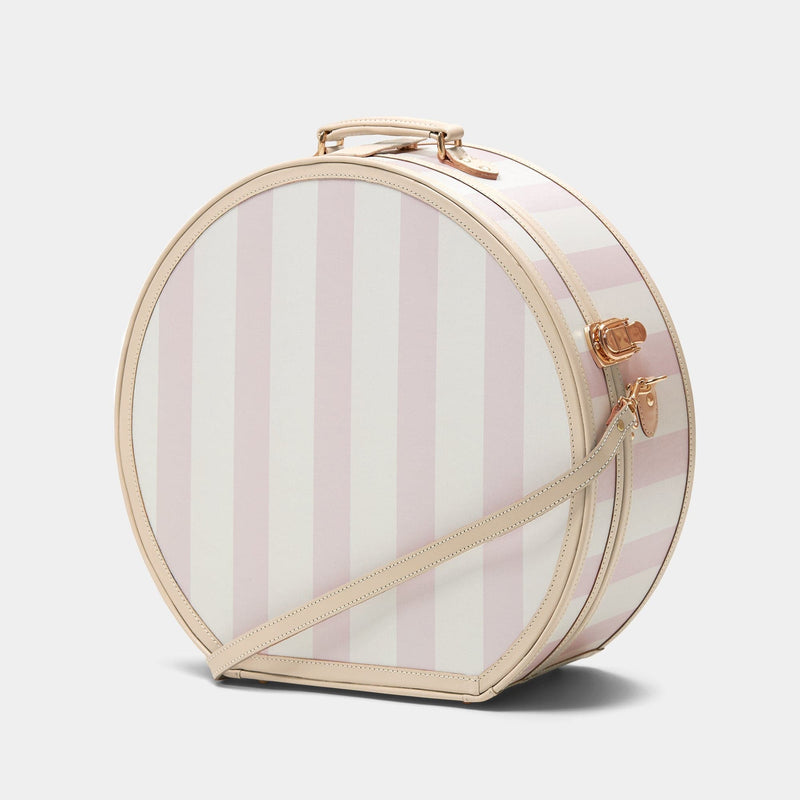 Angled product view of the deluxe hatbox Illustrator fibreboard suitcase in  pink-stripe with shoulder attachment strap