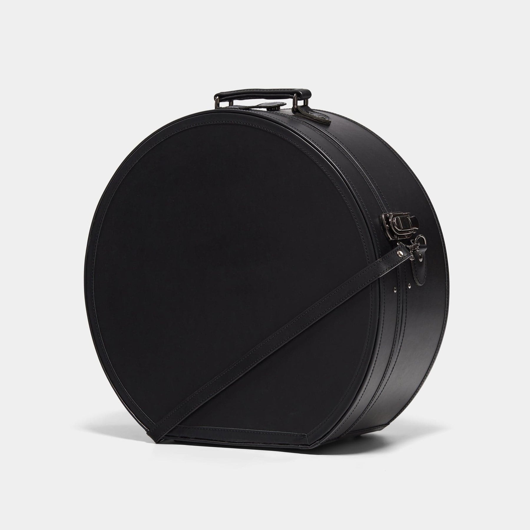 Angled product view of the deluxe hatbox Industrialist fibreboard suitcase in  black 