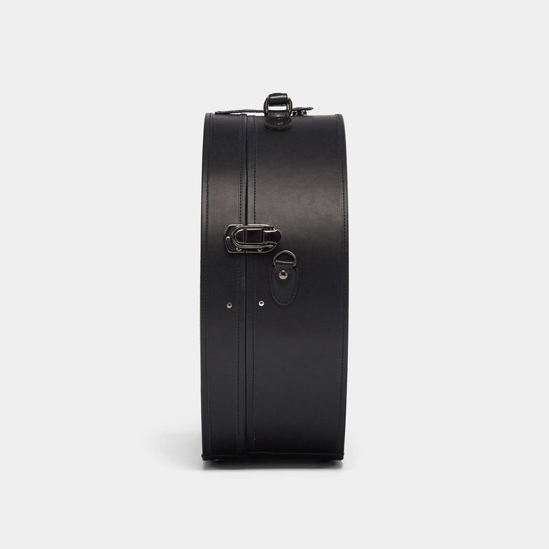 Side product view of the deluxe hatbox Industrialist fibreboard suitcase in black.