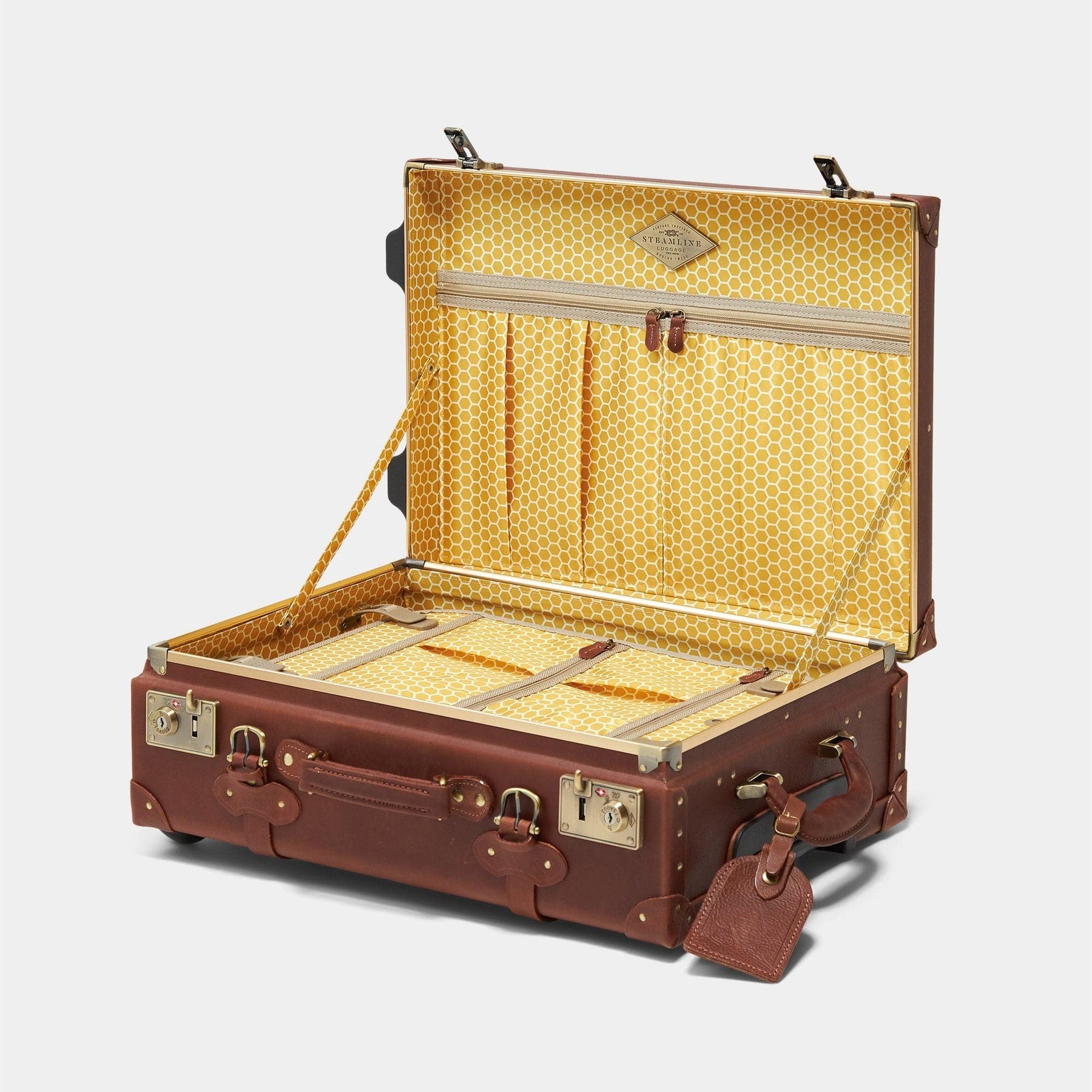 Open product view of the carry-on Pioneer leather suitcase in brown with honeycomb printed lining and brown leather tag