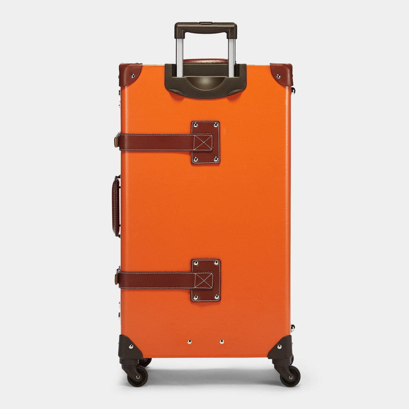 Back product view of the check-in Anthropologist leather suitcase in orange with raised handle
