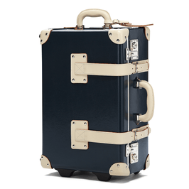 Angled product view of the carry-on Anthropologist leather suitcase in navy