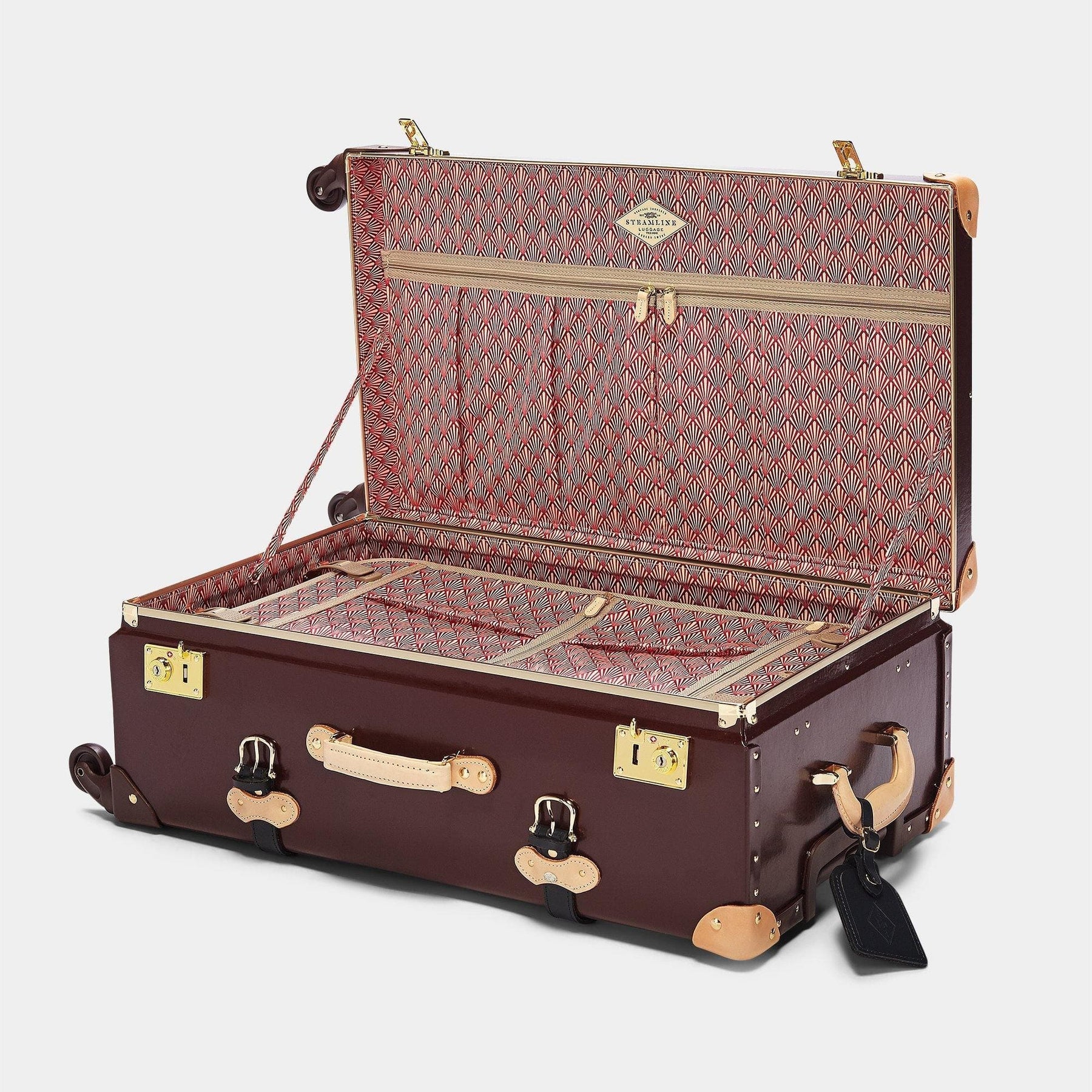 Open product view of the check-in Architect leather suitcase in burgundy with art-deco printed lining and black leather luggage tag