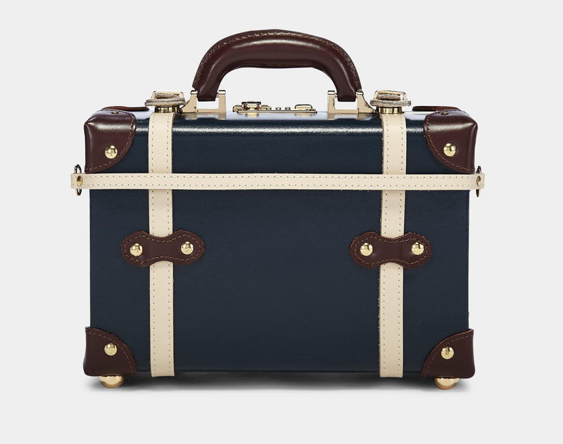 Product view of the vanity Architect leather suitcase in navy with suitcase attachment strap