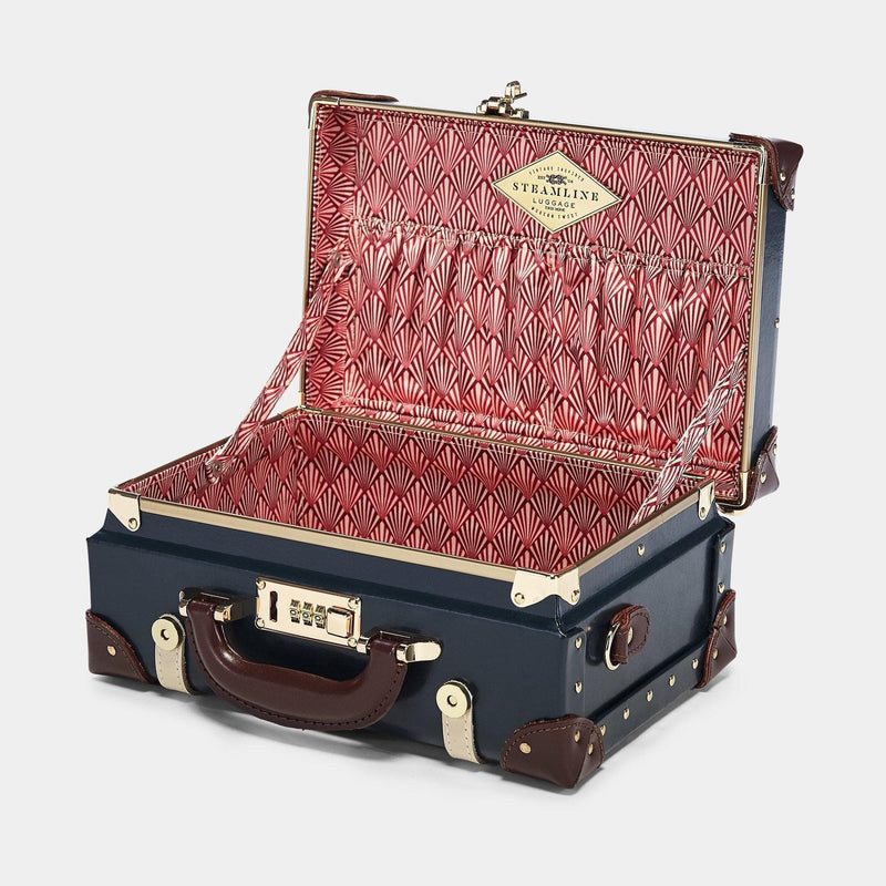 Open product view of the vanity Architect leather suitcase in navy with art-deco printed lining