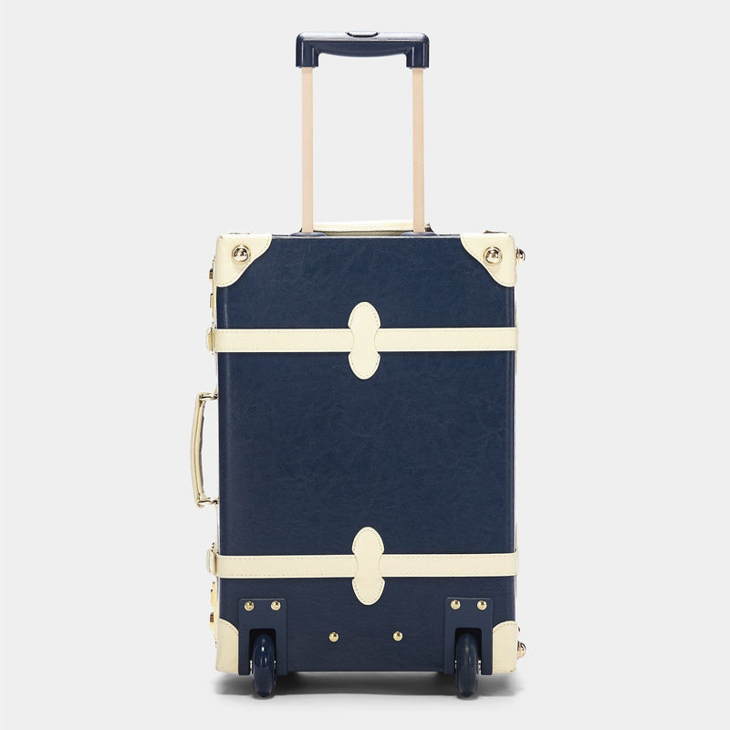 Back product view of the carry-on Entrepreneur vegan leather suitcase in navy with raised handle