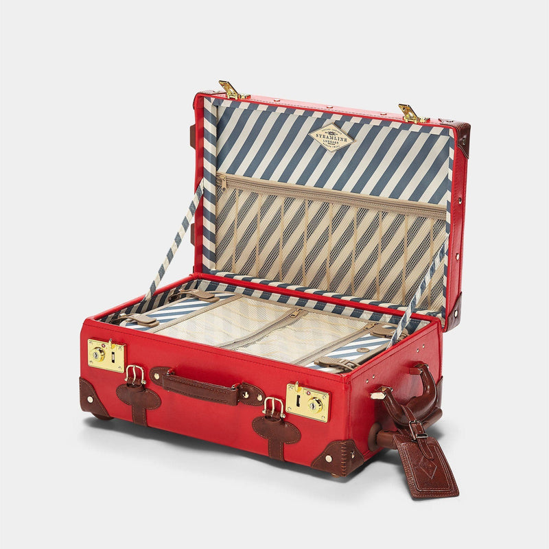 Open product view of the carry-on Entrepreneur vegan leather suitcase in red with blue-white stripe print lining and brown vegan leather luggage tag