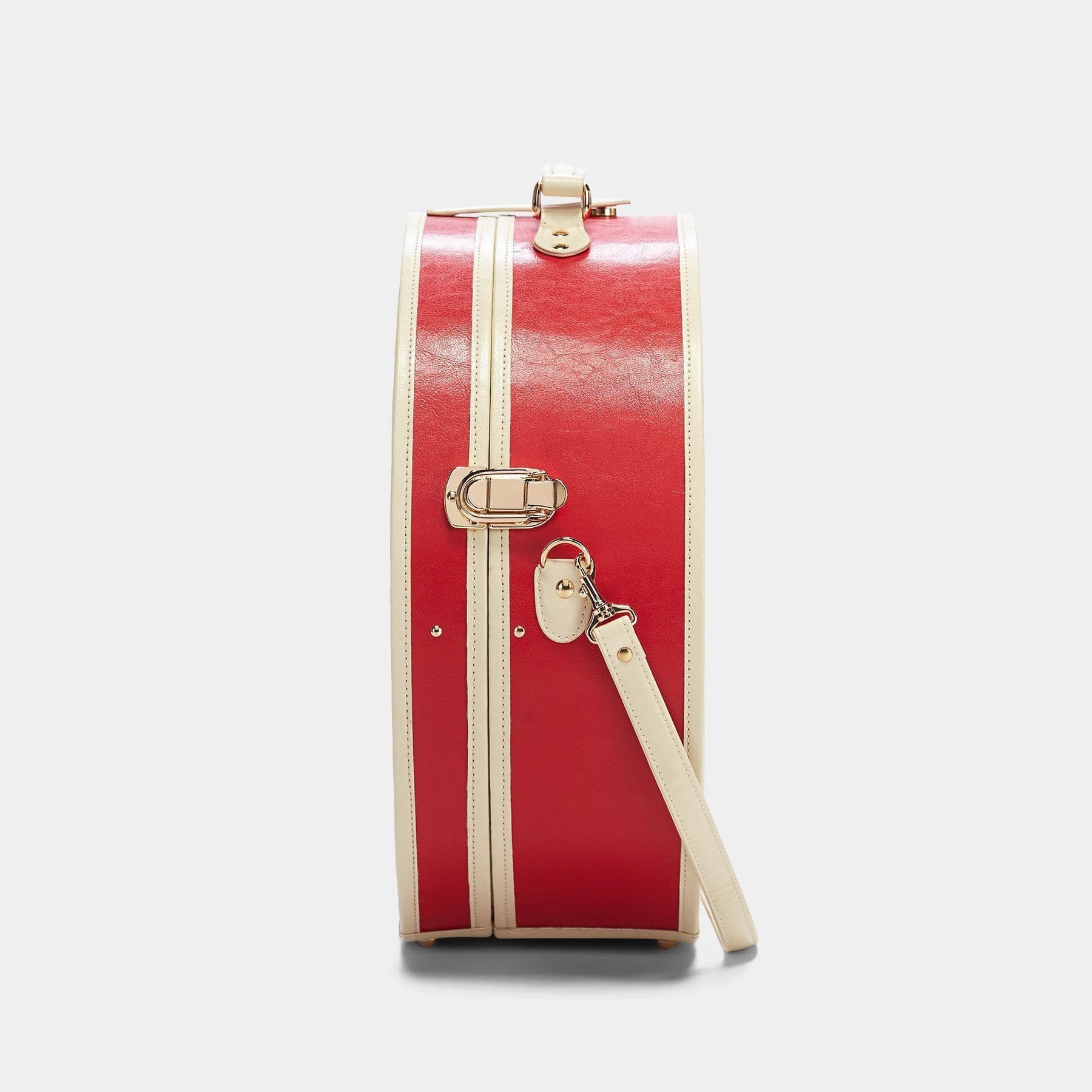 Side product view of the deluxe hatbox Entrepreneur vegan leather suitcase in lipstick red with shoulder attachment strap