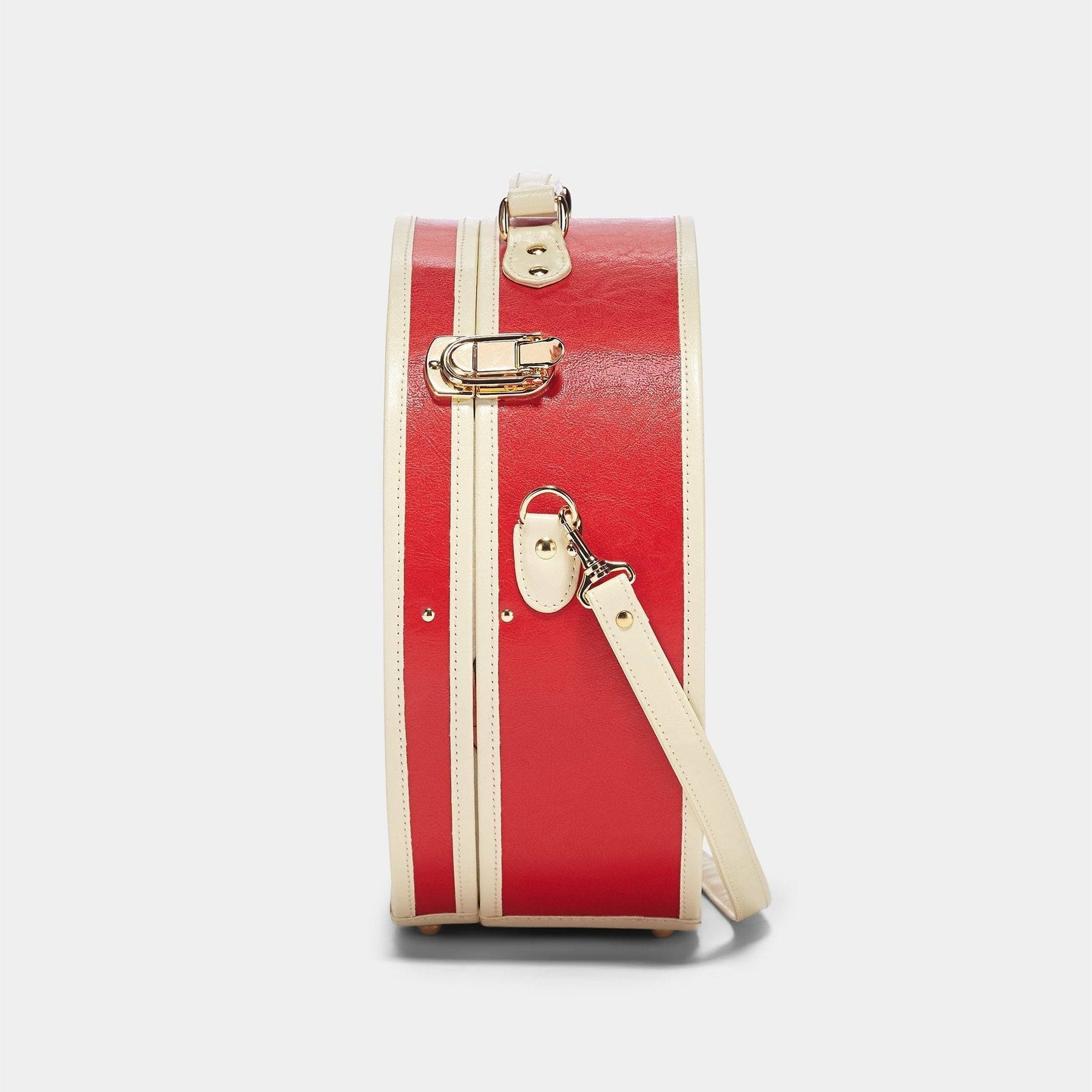 Side product view of the large hatbox Entrepreneur vegan leather suitcase in lipstick red with shoulder attachment strap