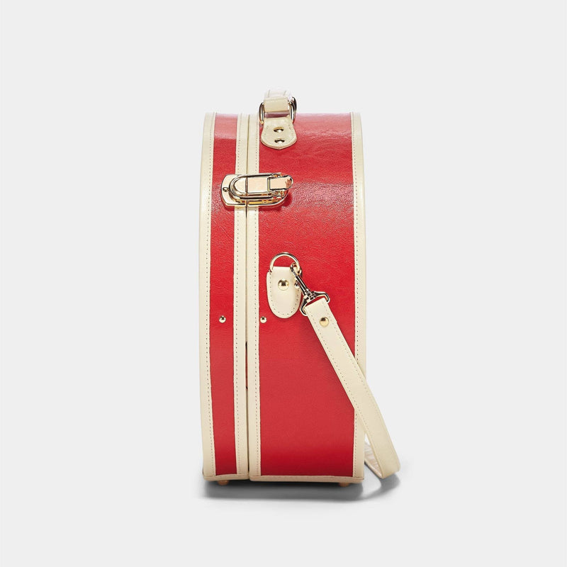 Side product view of the large hatbox Entrepreneur vegan leather suitcase in lipstick red with shoulder attachment strap