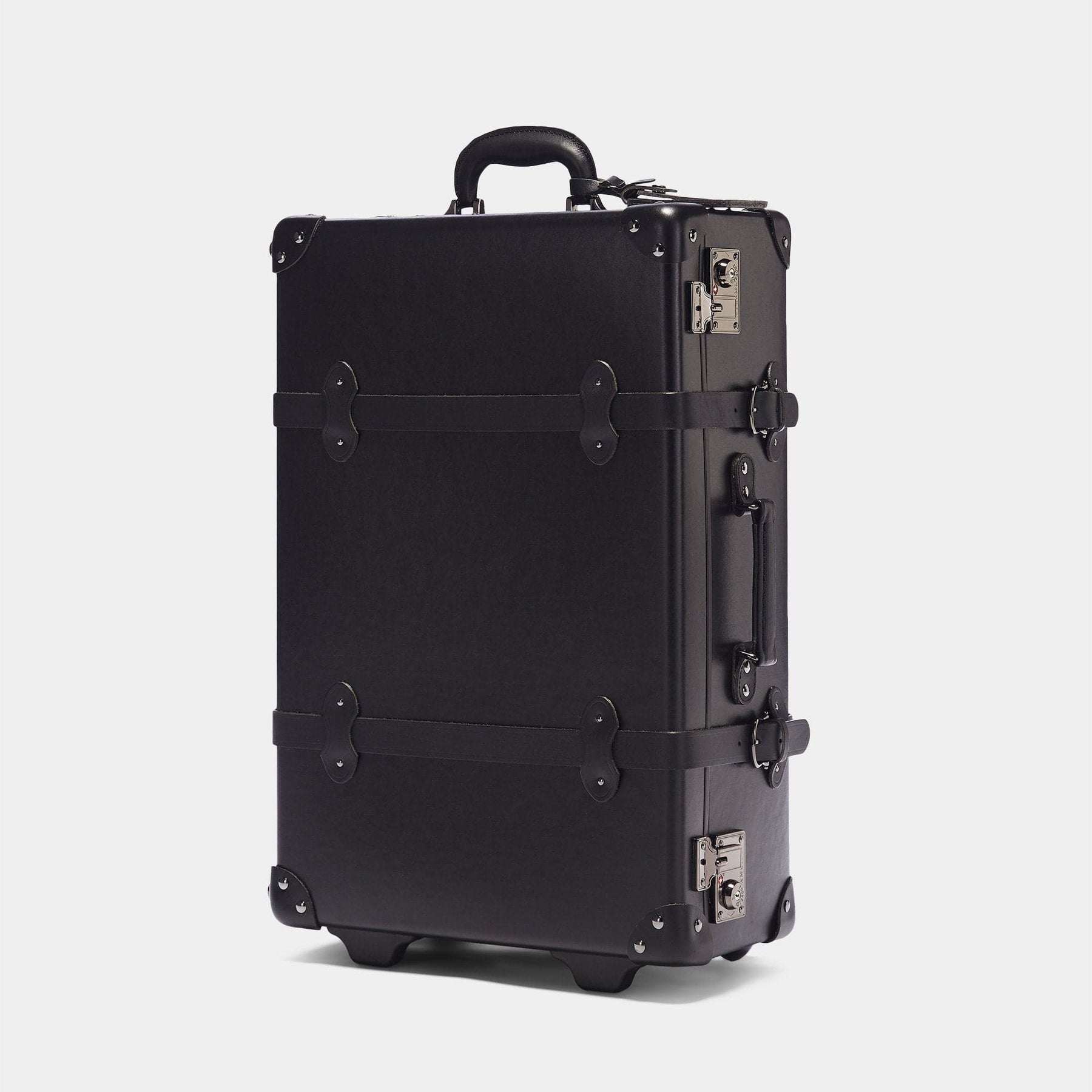 Angled product view of the stowaway Industrialist fibreboard suitcase in black