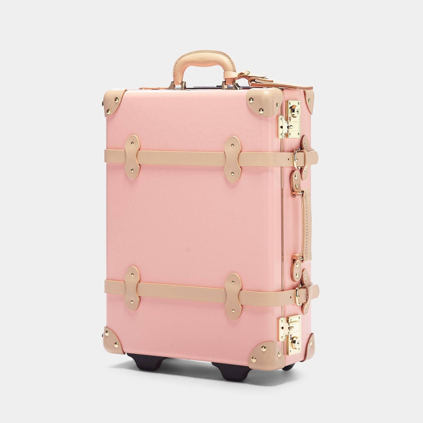 Angled product view of the carry-on Correspondent fibreboard suitcase in pink
