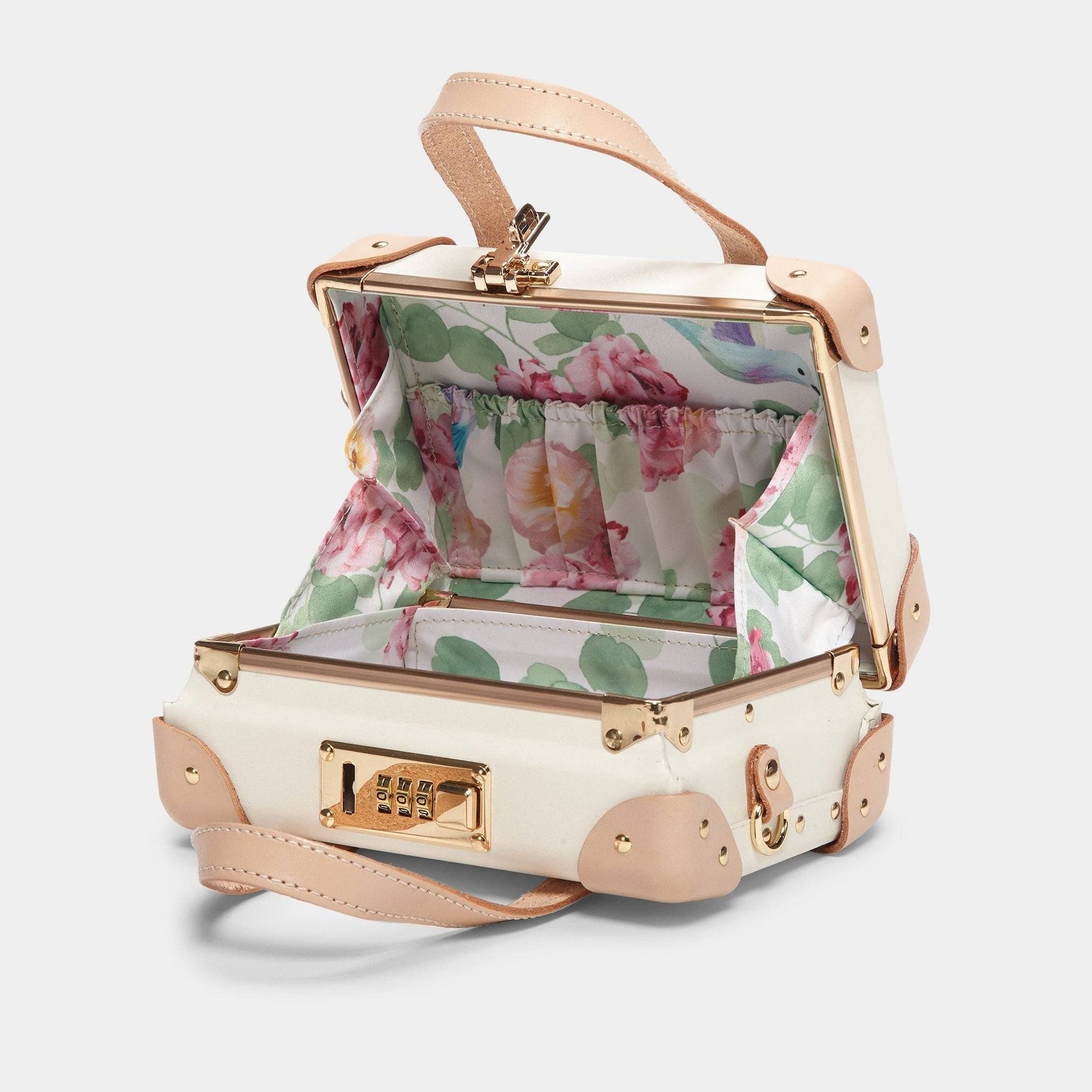 Open product view of the mini Sweetheart fibreboard suitcase in cream with botanical printed lining