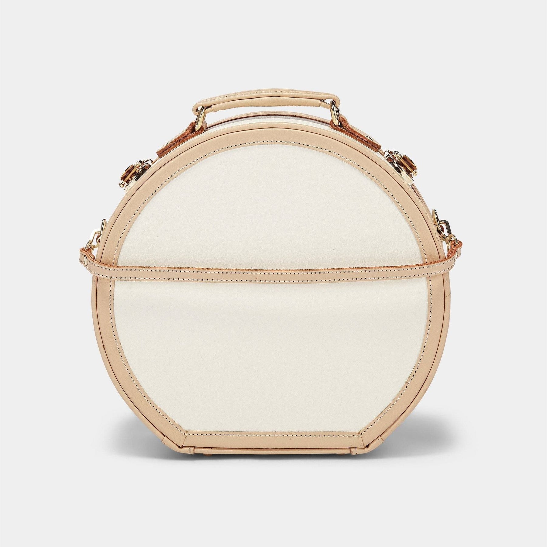 Product view of the small hatbox Sweetheart fibreboard suitcase in cream with detachable suitcase strap