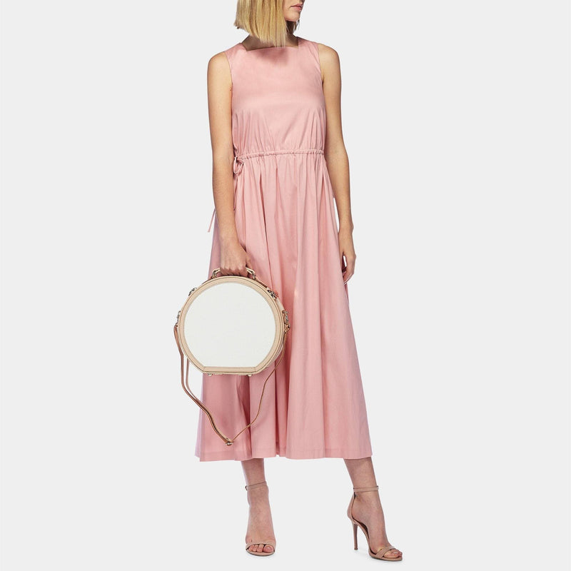 Model with the small hatbox Sweetheart fibreboard suitcase in cream with shoulder attachment strap
