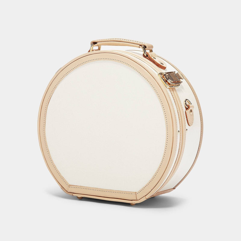 Angled product view of the small hatbox Sweetheart fibreboard suitcase in cream