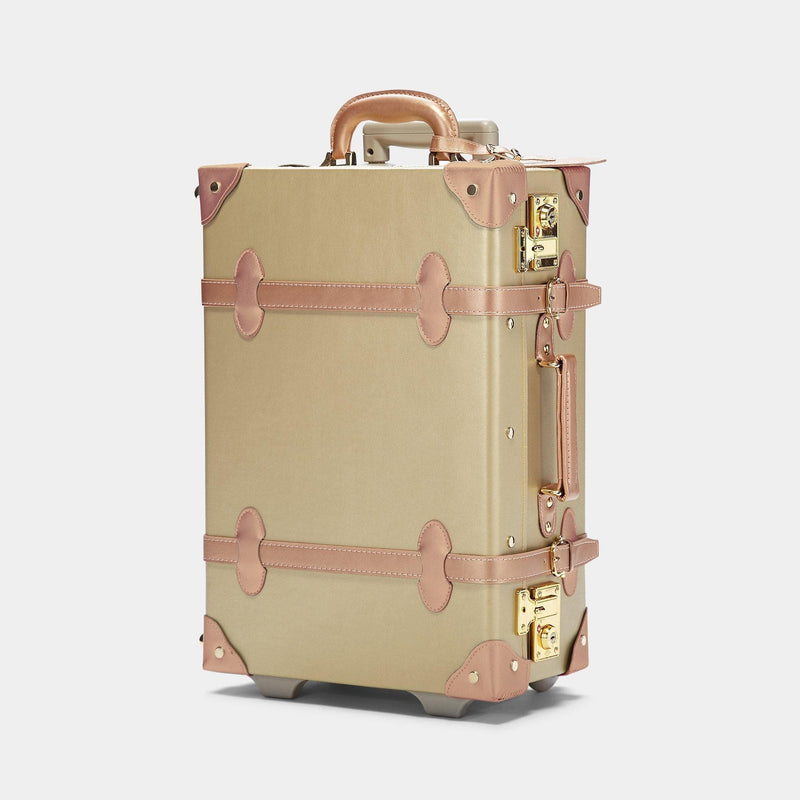 Angled product view of the carry-on Alchemist vegan leather suitcase in  gold