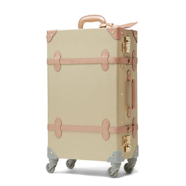 Angled product view of the check-in spinner Alchemist vegan leather suitcase in gold