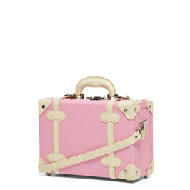 Angled product view of the vanity Entrepreneur vegan leather suitcase in  pink with shoulder attachment strap